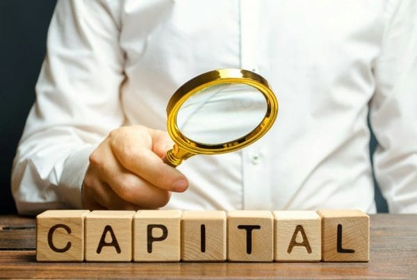 Businessman exploring the origin of capital